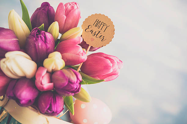 istock Easter arrangement with Easter basket and tulips 516103742