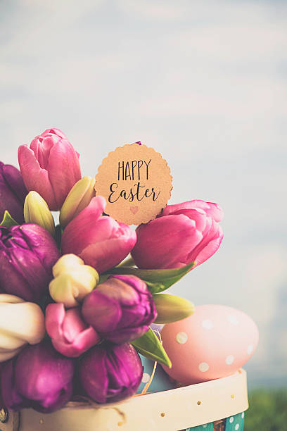 istock Easter arrangement with Easter basket and tulips 516103786
