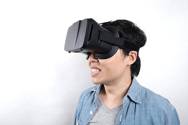 istock Asian man use VR glasses watching video 516104886