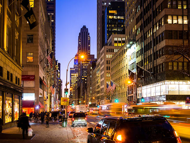 Yellow cab with panning motion at night in Manhattan, New York City