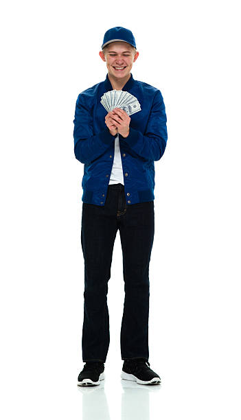 istock Smiling male holding money 516109256
