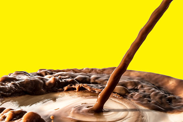 istock Chocolate liquid splash, pouring stream jet of chocolate, isolated 516110582