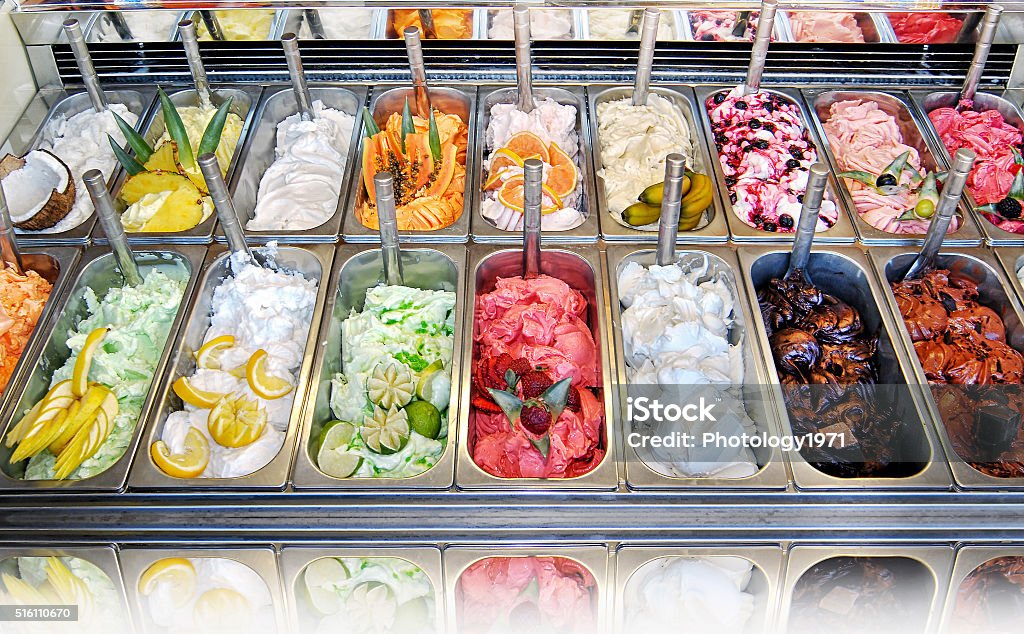 Display of assorted ice creams Display of assorted ice creams in metal tubs in a shop or ice cream parlour Ice Cream Stock Photo