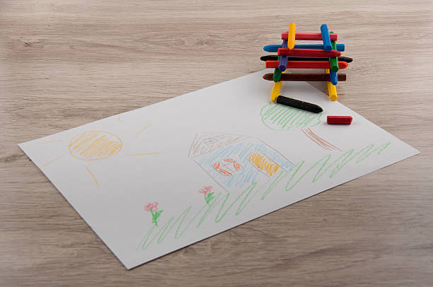 istock Stack of pencils and picture on wooden table 516110734