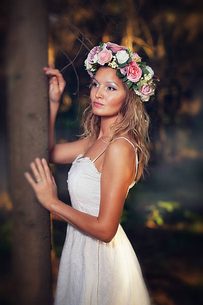 istock beautiful blond young woman in the forest 516110795