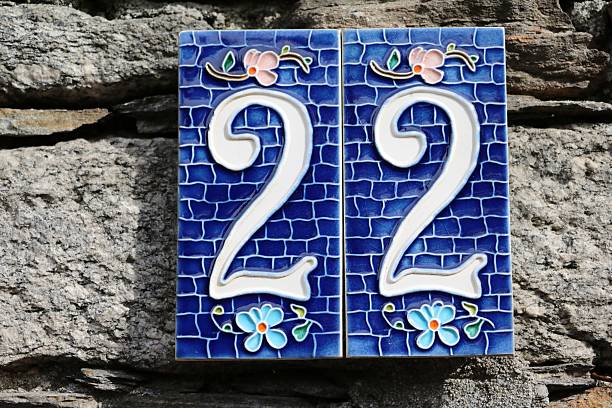 istock house number twenty two at old stone wall 516110954