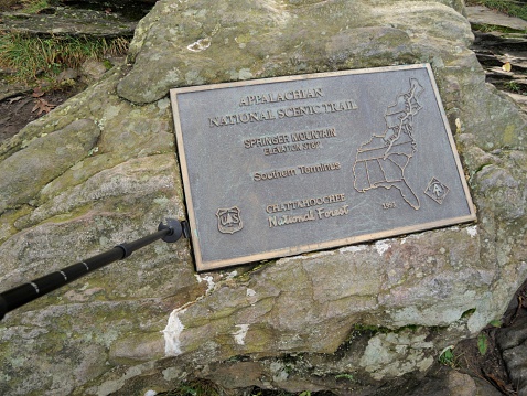 Springer Mountain, Georgia, USA - September 11, 2014: Sign embedded in rock on top of Springer Mountain in northern Georgia at the Southern Terminus of the Appalachian National Scenic Trail.  Sign shows map of trail.
