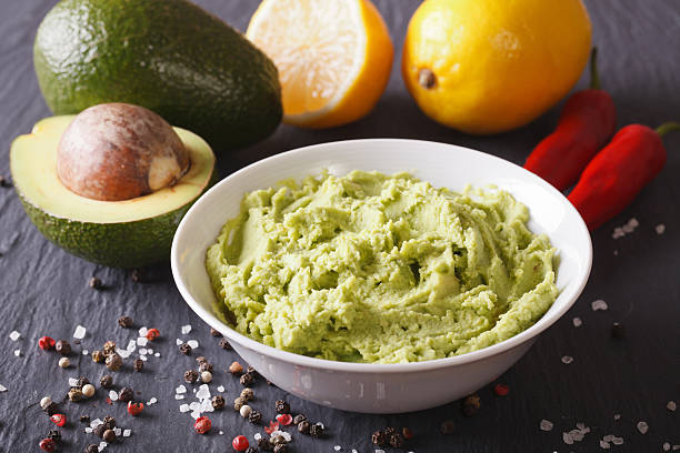 istock Delicious guacamole sauce and ingredients closeup. horizontal 516111320
