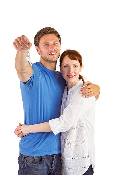 istock Couple holding keys to home 516112055