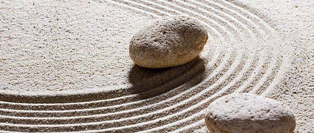 istock textured stones set on sinuous waves for concept of steadiness 516112638