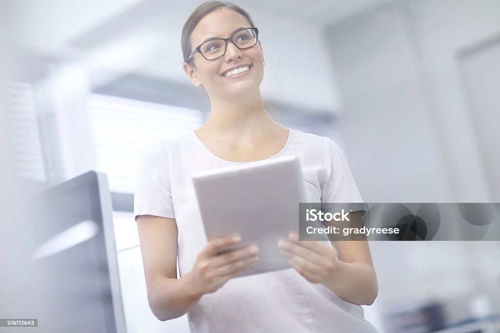 These numbers are better than I imagined Cropped shot of an attractive young businesswoman using a digital tablet 20-29 Years Stock Photo