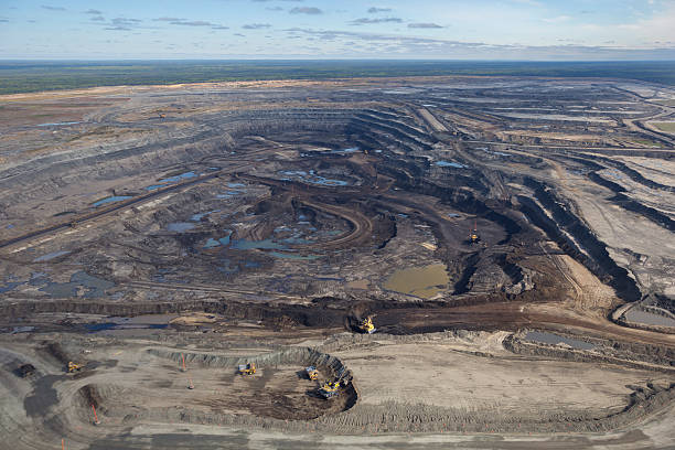 Oilsands Aerial Photo Expansive aerial view of a pit mining project in Alberta's Oilsands near Fort McMurray. oilsands stock pictures, royalty-free photos & images