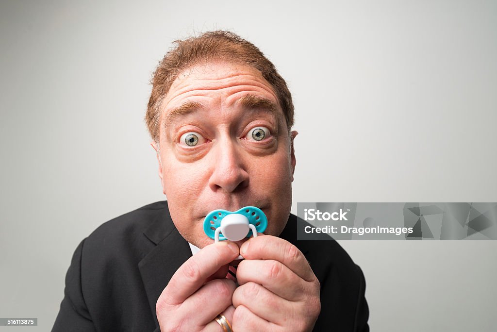 Manager mit Schnuller - Lizenzfrei Humor Stock-Foto