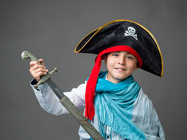 istock Little boy in halloween costume holding sword 516115133