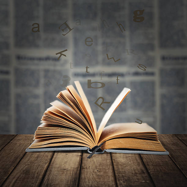 istock open book on the wooden desk 516115175