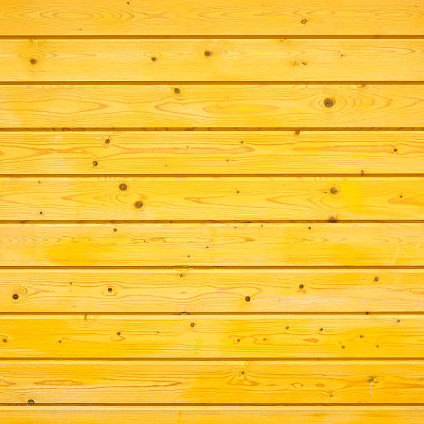 yellow wooden fence made of pine wood
