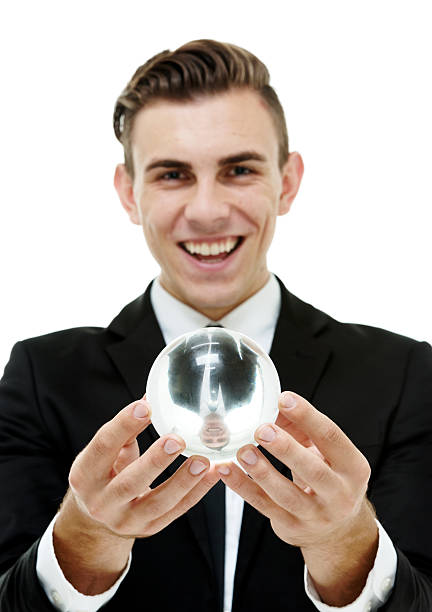 istock Cheerful businessman holding crystal ball 516116969