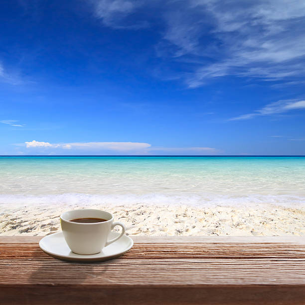 istock Cup of coffee on wooden table 516118139