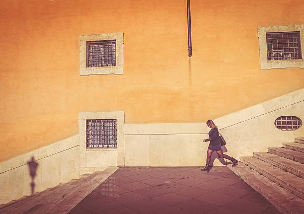 istock Woman walking in typical view of Rome 516131592