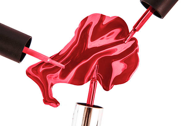 istock spilled nail polish over white background 516134066