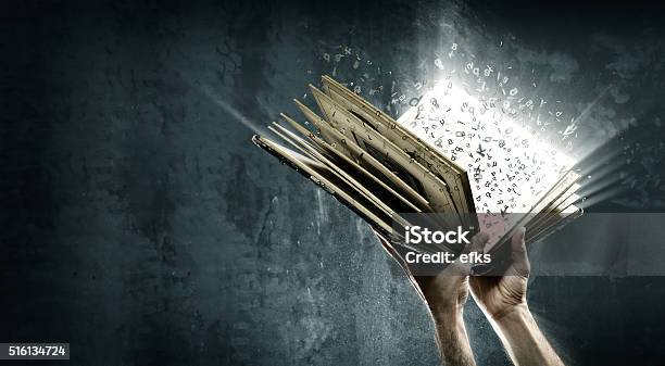 Opened Magic Book With Magic Lights Stock Photo - Download Image Now - Book, Storytelling, Writing - Activity