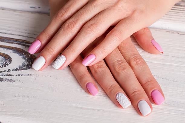 istock Gentle colors of spring manicure. 516134942