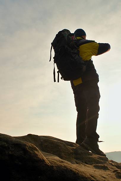 istock Tourist on cliff and watching into valley bellow. Sunny spring 516135164