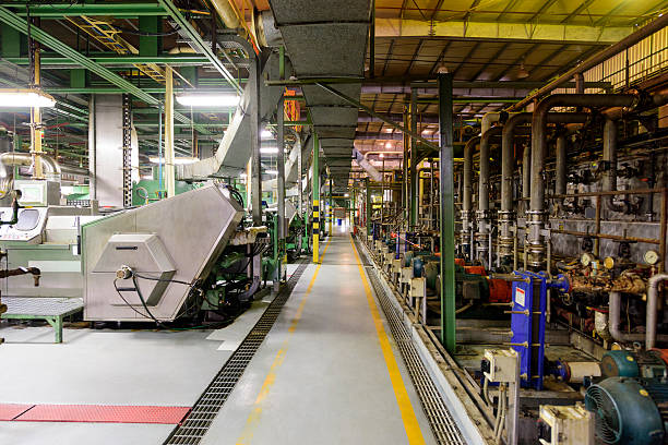 Equipment and machines used in the production of aluminium metal. Industrial processes on the factory floor.