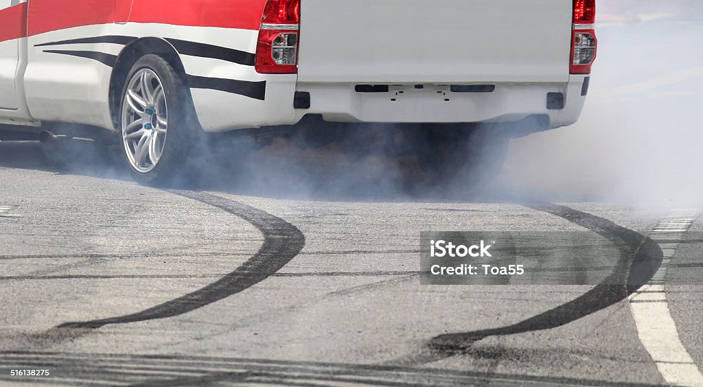 Emergency braking wheel with smoke on the highway. Car Stock Photo