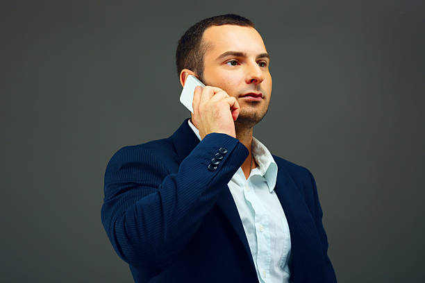 istock businessman talking on the phone 516141309