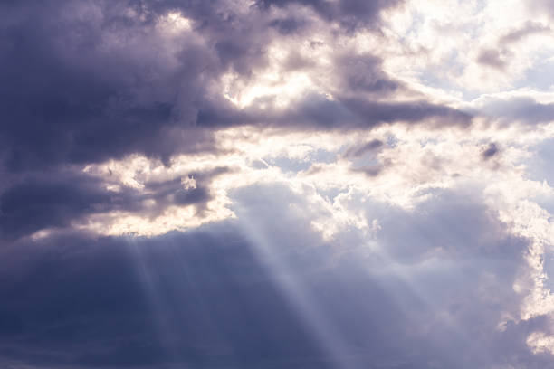 istock Sunbeam through the haze on blue sky, clud with sunlight 516142284