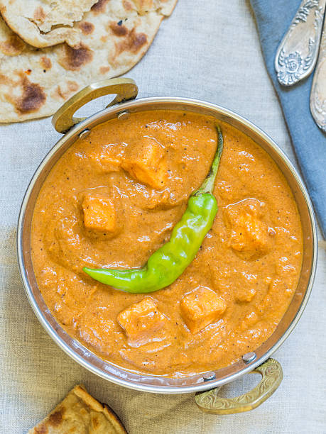 istock Paneer butter masala in a traditional copper pot. 516142578