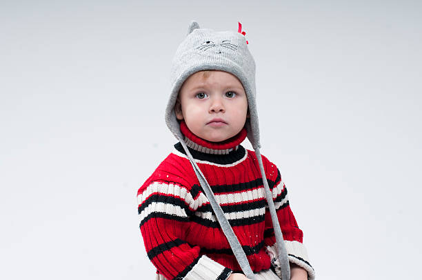 istock little boy dressed in winter clothes 516143720