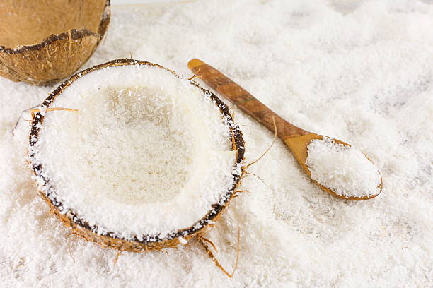 istock Halved fresh coconut and coconut powder 516143802