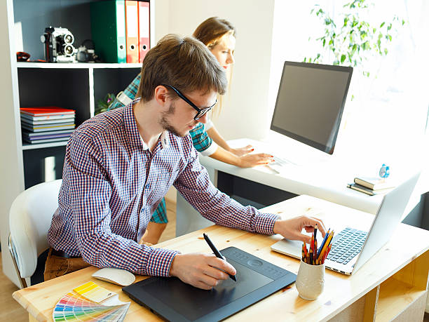 istock Young artist drawing something on graphic tablet 516144154