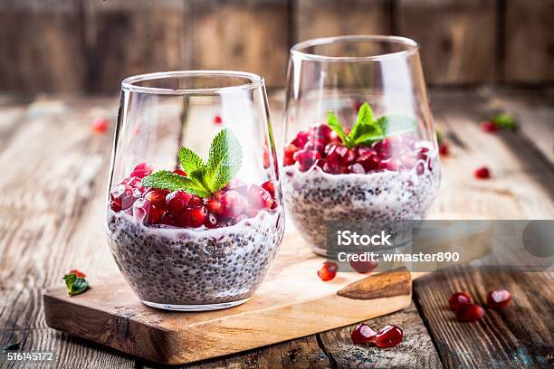 Chia Pudding With Pomegranate Seeds And Mint Stock Photo - Download Image Now - Chia seed, Pomegranate, Dessert - Sweet Food