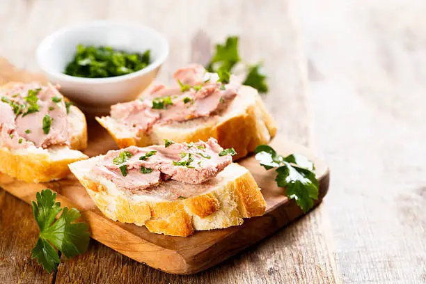 Pate with fresh baguette and herbs