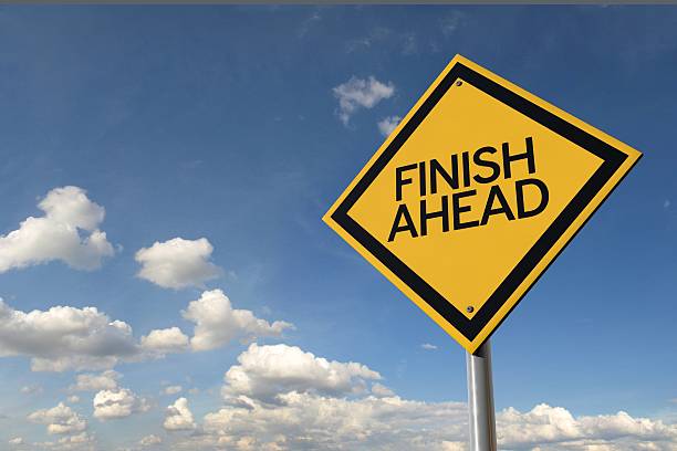 istock Finish ahead yellow highway road sign 516147070