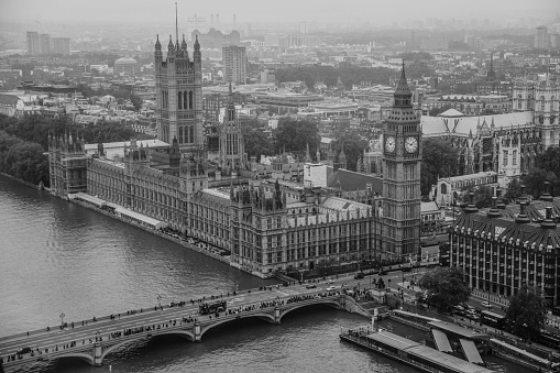 Ottawa cityscape panorama in the day over river with historical architecture black and white.