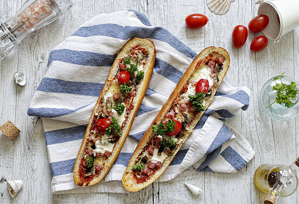 Baguette boats with chicken and mushrooms stock photo