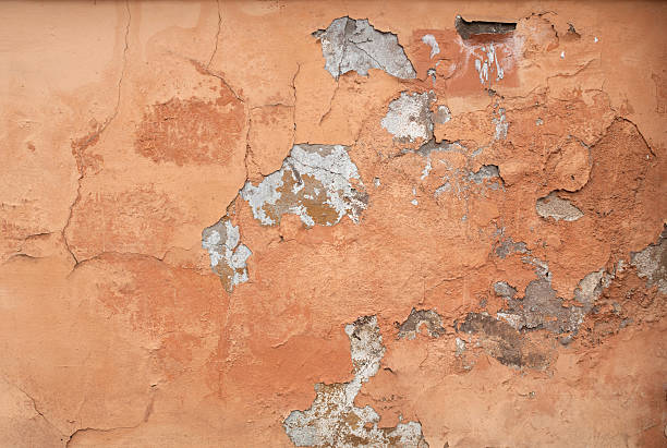 istock Texture of wall covered yellow stucco relief 516162905