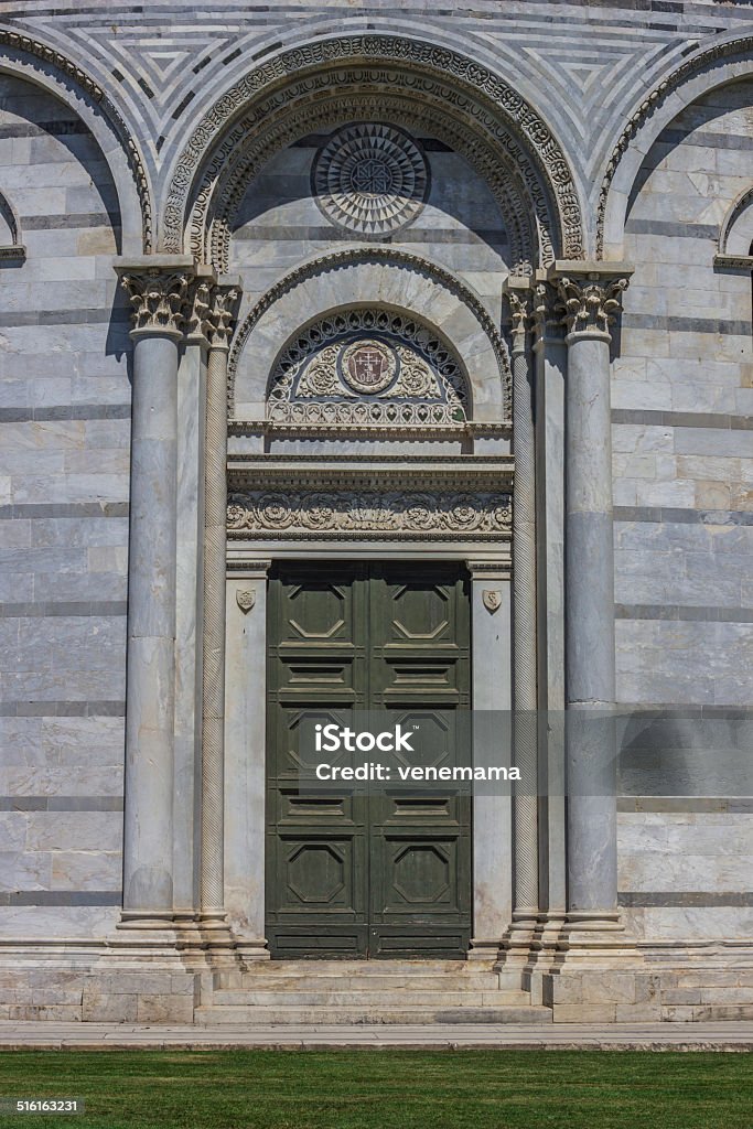 Door of the baptistery at the piazza dei miracoli in Pisa Door of the baptistery at the piazza dei miracoli in Pisa, Italy Architecture Stock Photo