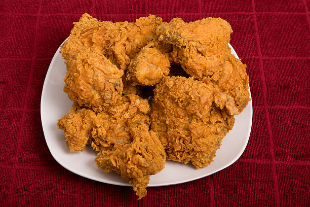 istock White Plate of Fried Chicken on Red Towel 516164415