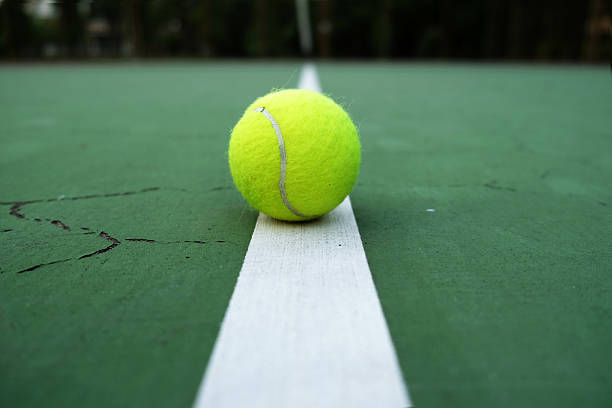 istock tennis ball on court 516164983