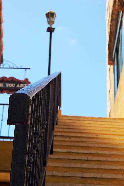 istock Vintage stairs with a light pole and sky. 516166629