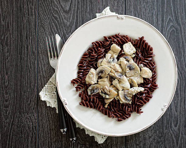 Chocolate pasta on a white plate stock photo