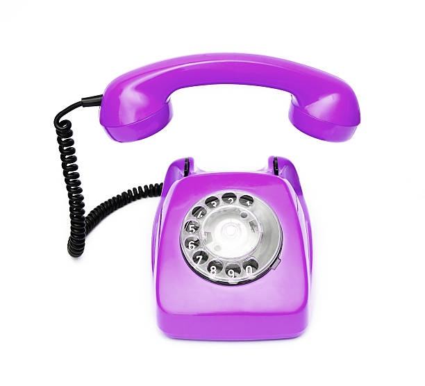 istock Purple retro telephone isolated on white background. 516173966