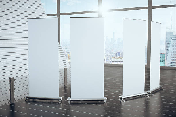 Blank posters on wooden floor in futuristic interior