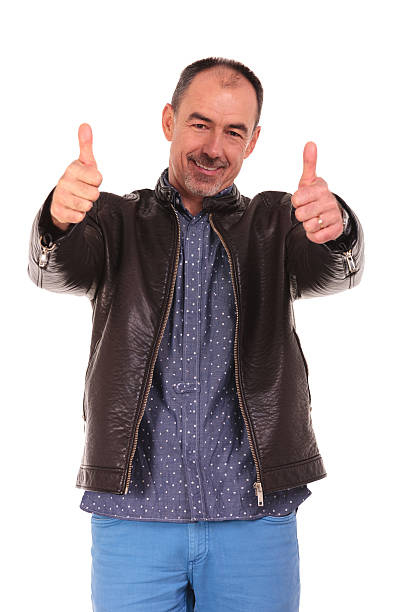 istock mature man showing the thumbs up sign 516176588