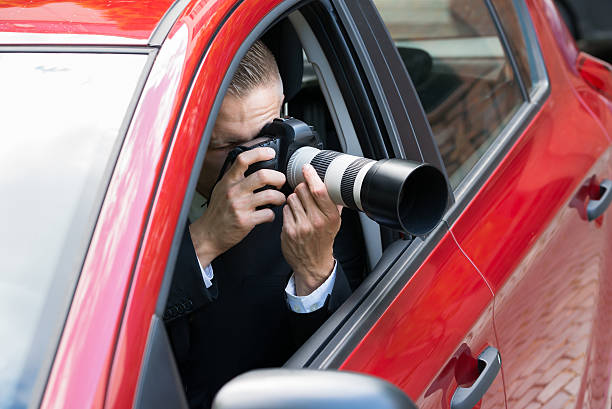 istock Man Photographing With Slr Camera From Car 516177036